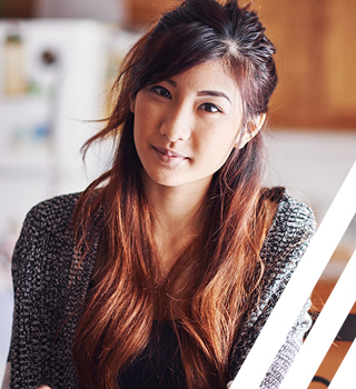 Asian woman sitting and smiling 