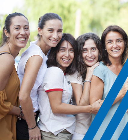 group of women standing together and smiling 