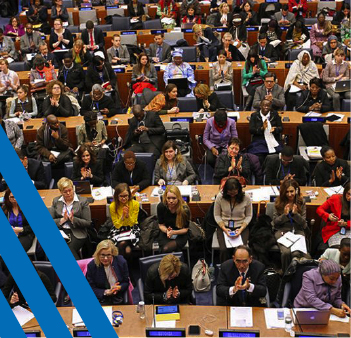 UN Commission sitting at tables together