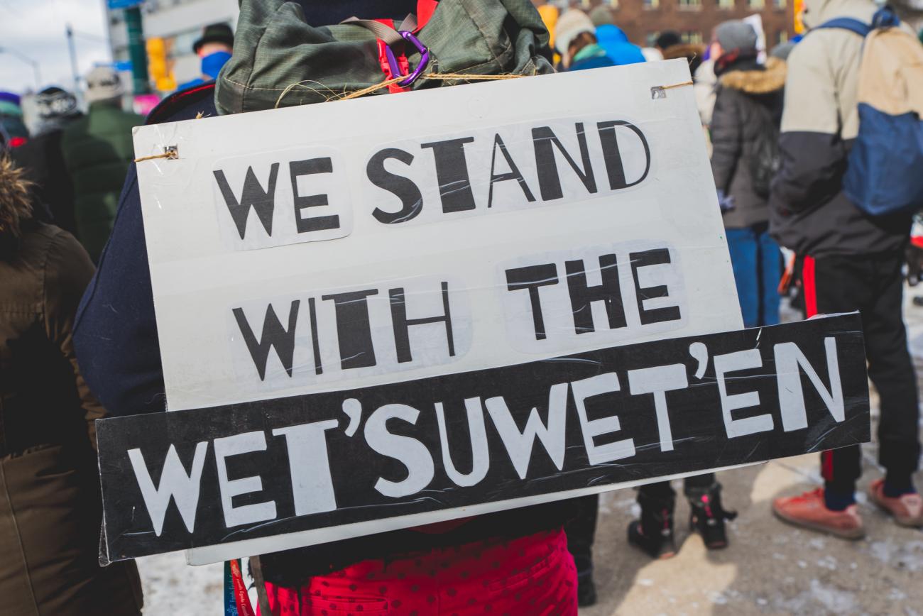 image of sign with text We Stand With The Wet'Suwet'En
