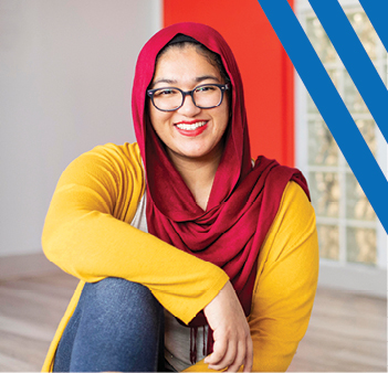woman with glasses smiling