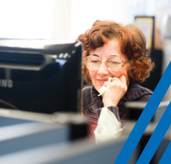 one woman at a desktop computer