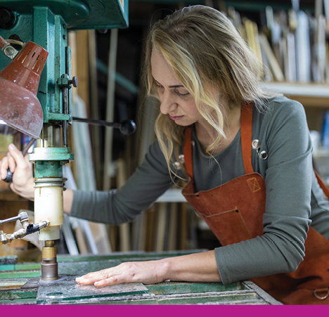 woman working on glass machine