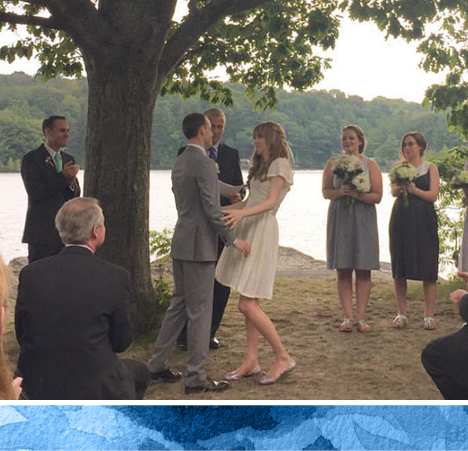 wedding party outside by the lake