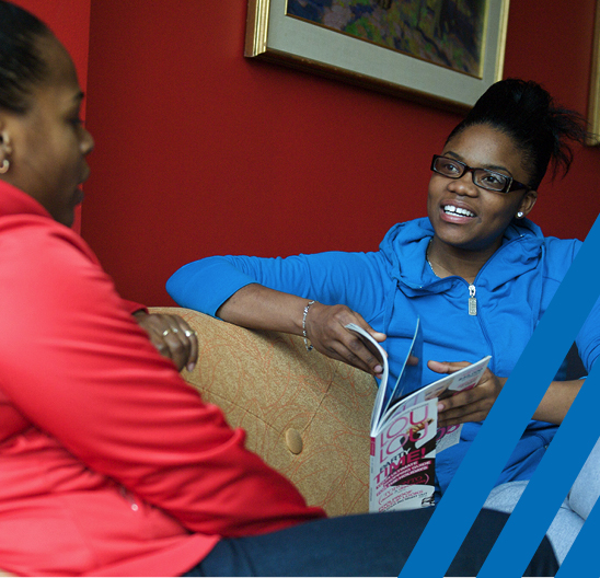 two women sitting having conversation