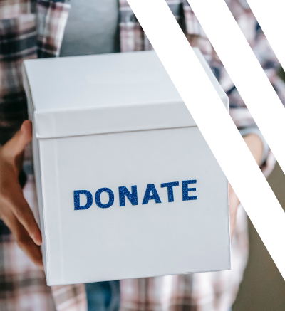 person holding box with the word DONATE on the side